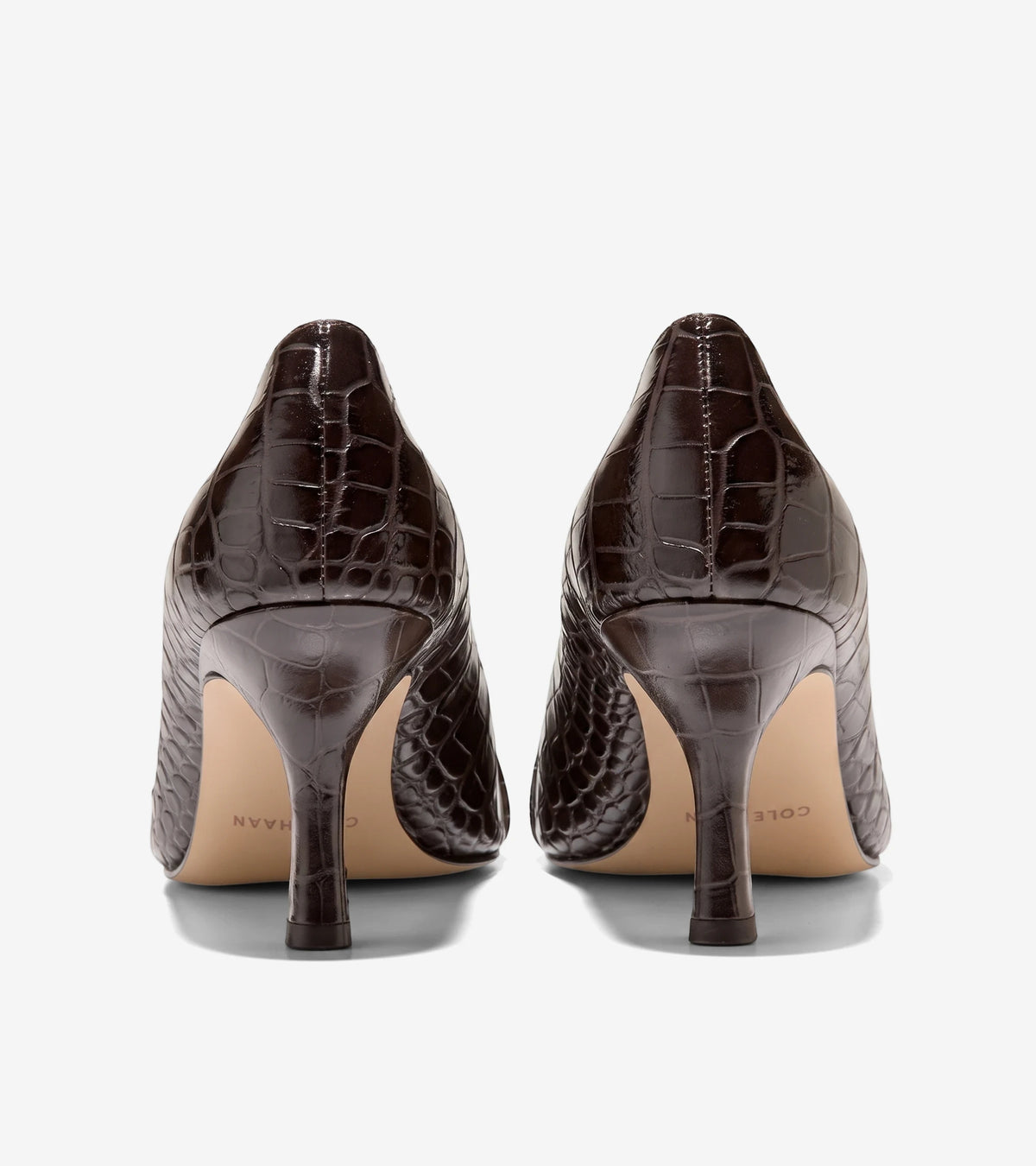 Dark brown crocodile print Fidela buckle pumps with mid-height heels, viewed from the back. Elegant women's footwear.