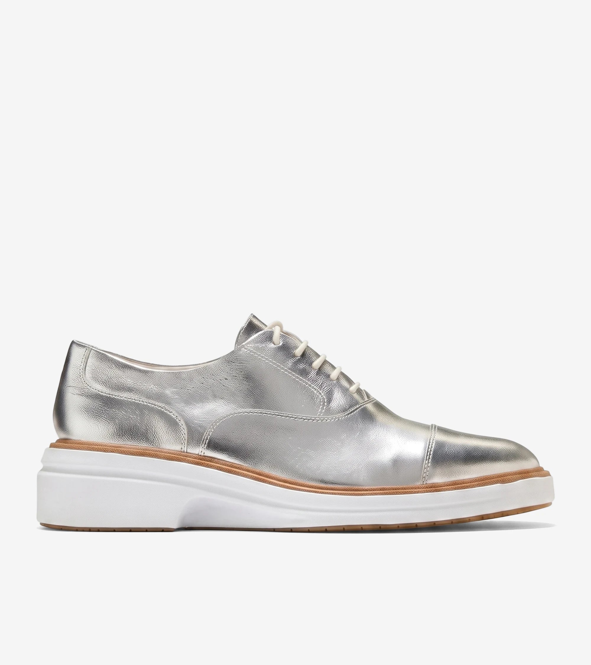 Women's metallic silver ØriginalGrand CitySpectre Oxfords with white laces, a cap toe, and a chunky white sole.