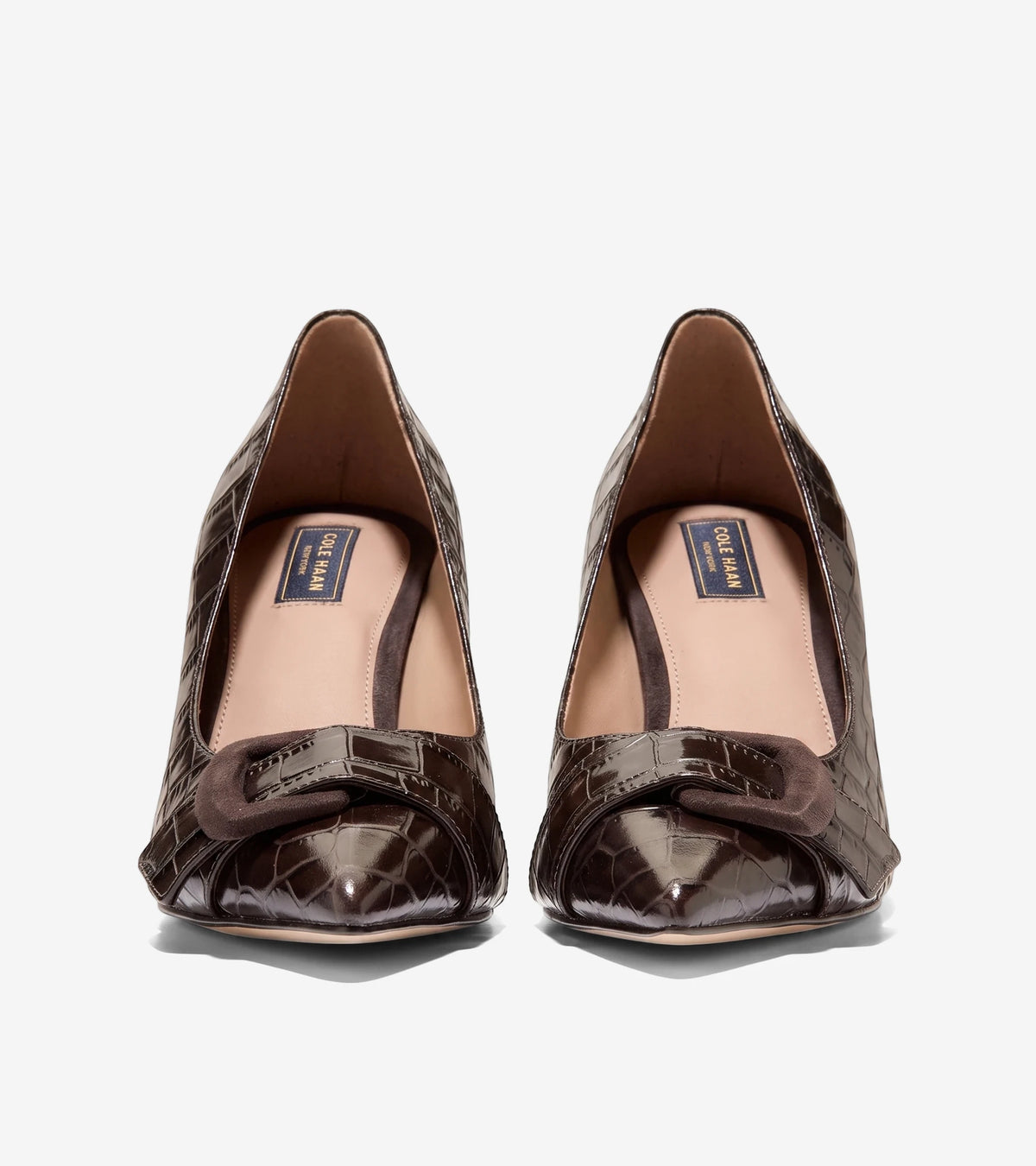 A front view of a pair of women's Cole Haan Fidela Buckle Pumps in dark chocolate crocodile print leather.