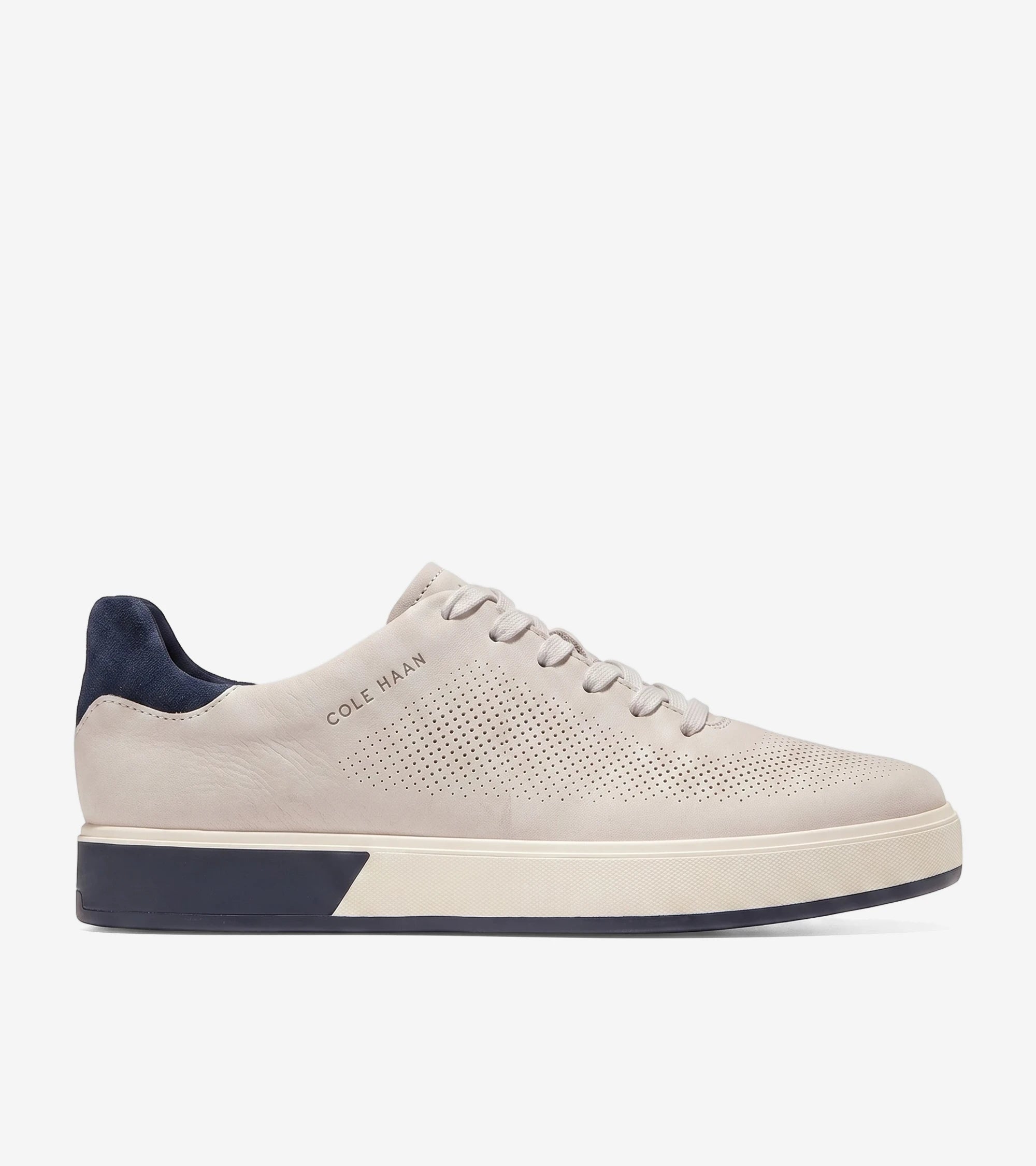 Cole Haan GP Angleace low-top sneakers in pumice nubuck with navy blue accents, side view.