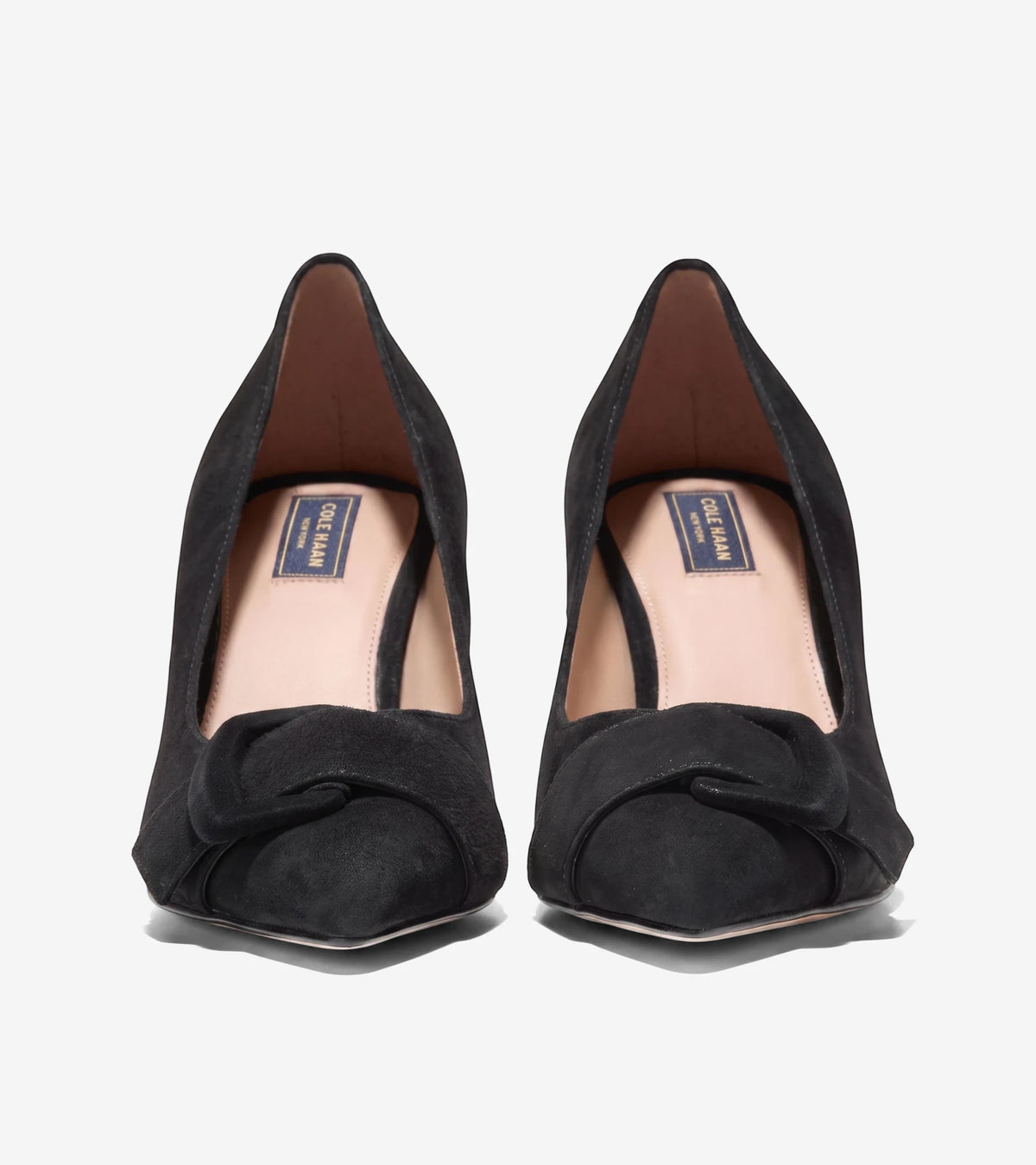 Black suede Fidela buckle pumps with a elegant knot detail on the vamp, presented from a front view.
