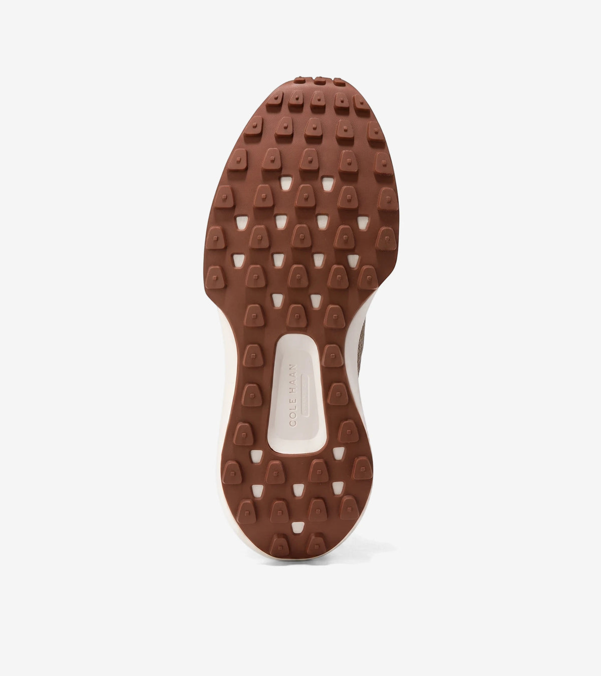 Bottom view of a Men's GrandPrø Ashland Stitchlite™ Sneaker, featuring a brown rubber sole with a studded traction pattern